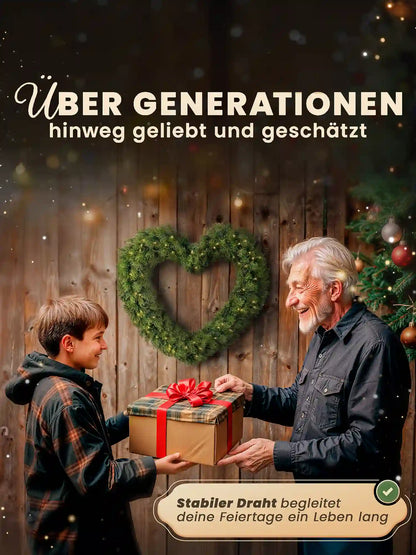 Grandfather and grandson exchange Christmas gifts, with an artificial heart-shaped Christmas wreath by ArtiTree hanging on a wooden wall in the background